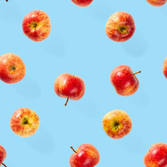 Seamless pattern with ripe apples. Tropical fruit abstract background. Apple seamless pattern on blue background.