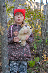 Beautiful portrait caucasian child in autumn forest