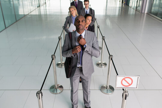 Business people waiting in queue