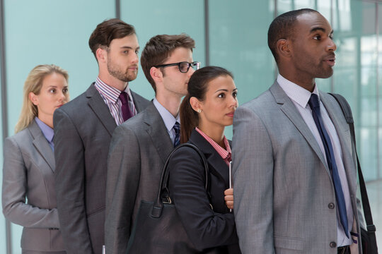 Business people waiting in queue