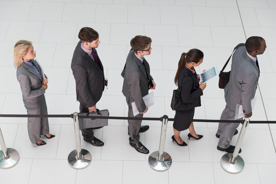 Business people waiting in queue