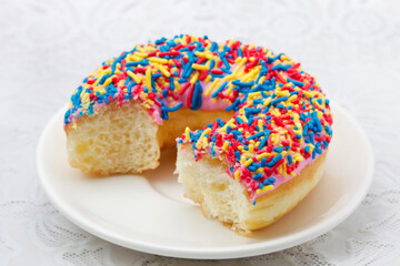bite chocolate donuts on a white background