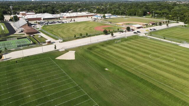 American Sports - Football, Soccer, Tennis, & Baseball Fields - Aerial Drone Establishing View