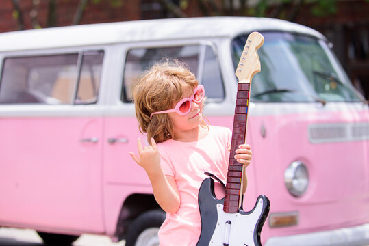 Caucasian Little Boy Learning To Play Guitar. Rock Star Kids.