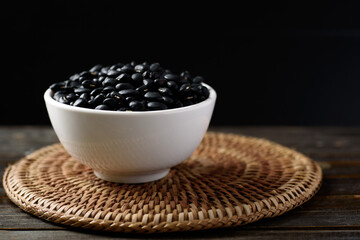 Close up of organic black beans in healthy food concept