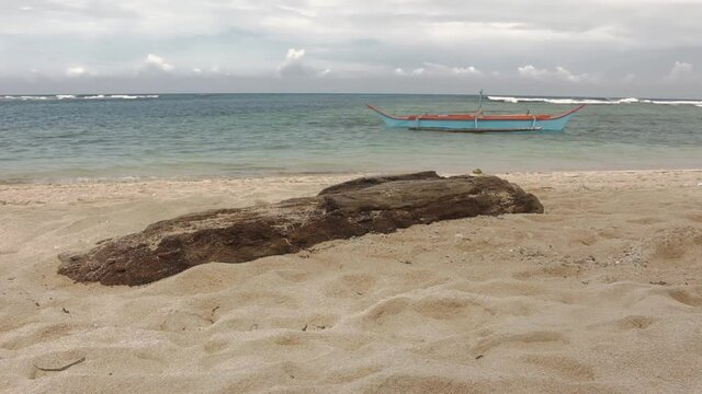 fishing boat on the beach, boat with outriggers, paraw or bangka