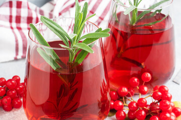 Drink from the berries of red viburnum in glass Cup. Berry compote with vitamin C against the common cold.