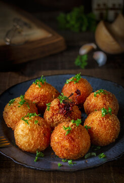 Traditional Italian arancini (rice balls with Mozzarella cheese) 