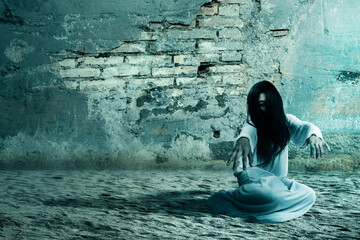 Scary ghost woman crawling with a cracked wall background