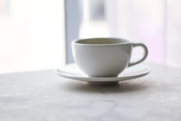 Fototapeta na wymiar coffee cup on desk - black coffee in white mug on the table