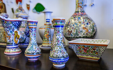 Traditional Portuguese ornate pottery with azulejo design on display at a souvenir shop in Porto, Portugal