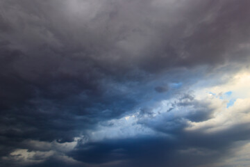 Fototapeta na wymiar Dark storm clouds in sky before thunderstorm and rain. Dramatic sky background