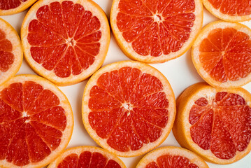 Naklejka na ściany i meble Background of slices of grapefruit close up