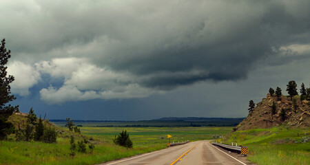 Obraz premium Montana - Storm Clouds on the Horizon over Highways 3 & 12