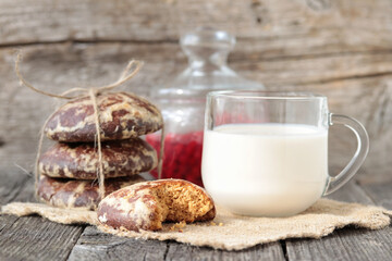 Morning breakfast with ginger bread,dairy products and egg on a wooden background.