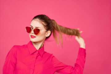Woman in pink shirt and brown glasses cropped view fashion model emotions gesturing hands portrait