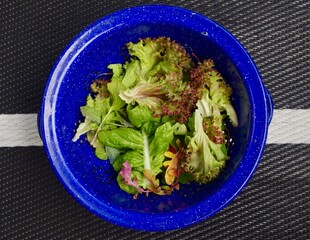 salad on a blue colander 