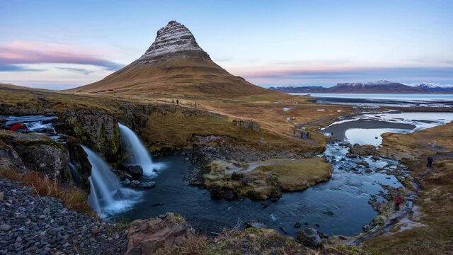 4K Timelapse of sunrise over kirkjufellsfoss waterfall and Kirkjufell mountain, Iceland
