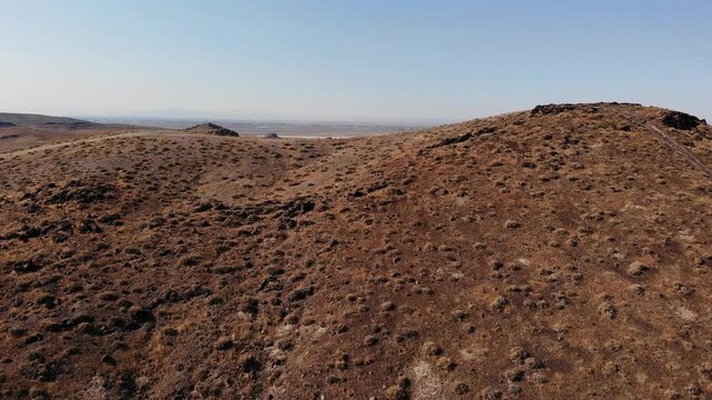 Aerial Drone Clip of Rainbow Mountain near Fallon, Nevada.  Rainbow Mountain is a popular Rock Hounding Destination and is rich in Wonder Stone.  Vast Wide Open Desert Landscape with Dirt Roads.