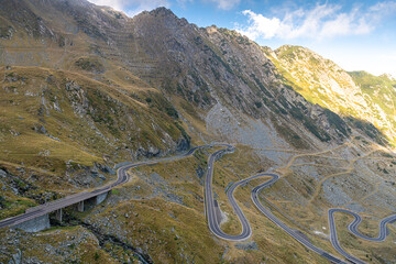 Transfagarasan road in Romania - curved amazing motorway through the mountains from Transylvania in a cloudy day with spectacular sky