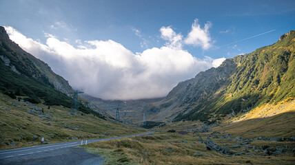 Transfagarasan road in Romania - curved amazing motorway through the mountains from Transylvania in a cloudy day with spectacular sky
