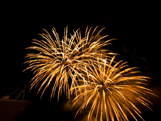 Fototapeta premium Burning sparklers on black background. Small fireworks giving off sparks of fire. Sparks explosion.