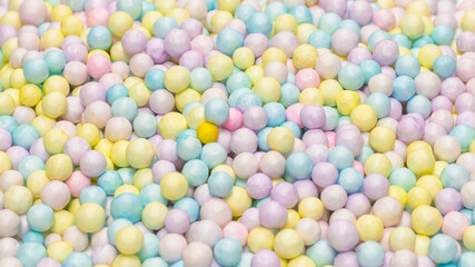 Purple, yellow, blue plastic balls.