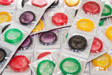 Colorful condoms background.