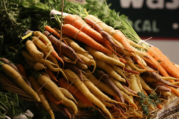 many carrots on the table at farmers market
