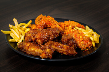 Fried chicken sprinkled on spicy sauce and bbq sauce