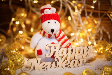Christmas Doll with garlands decoration and Happy New Year text. Christmas holiday season toy.