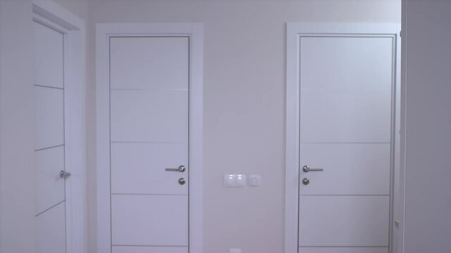 Young married couple in pajamas sees something incredible. They look at each other in disbelief and faint with shock rolling their eyes, front view. Vivid expression of emotions.