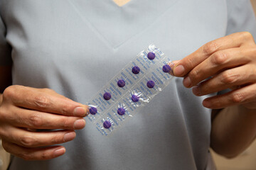 Nurse keeps purple disclosing tablets