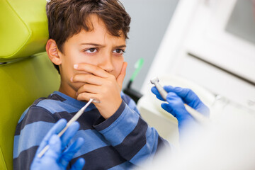Young boy is afraid of dentist. 