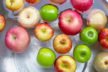 Washing fresh apples in the water