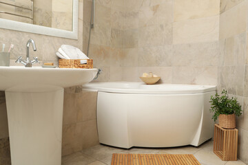 Modern comfortable bathroom in light beige color