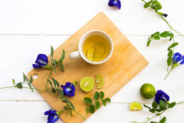 herbal healthy drinks honey lemon tea for cough sore throat with lemon slice ,blue flower butterfly...