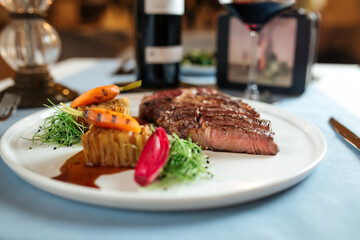 Cut grilled beef ribeye steak with potatoes