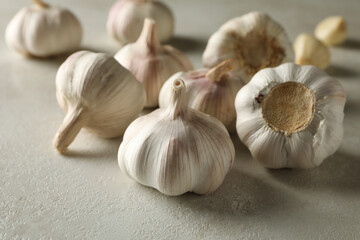 Raw garlic on light background, close up