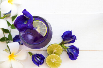 herbal healthy drinks  mix lemon and  flower butterfly pea purple cold cocktail water local flora...