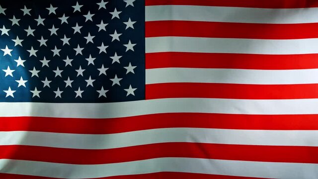 Close up of American Flag Waving. USA Banner Flaping in Wind. Concept of 4th of July, Independence Day, American Election and Other Feasts