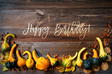 Colorful Yellow And Orange Pumpkins As Autumn Season Decoration With English Text Happy Birthday....