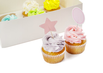 Box with tasty cupcakes on white background