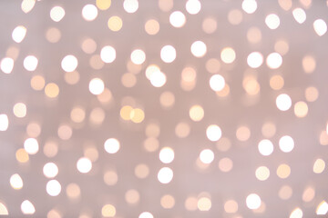 Blurred Christmas lights on grey background