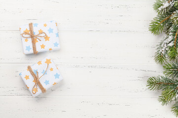 Fototapeta na wymiar Christmas gift boxes over wooden background