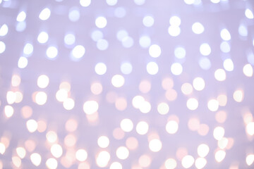 Blurred Christmas lights on grey background