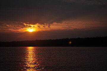 Fototapeta na wymiar panoramic sunset on the edge of the sea towards the evening