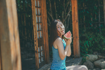 Summer watermelon and sweet girl in Japanese Garden