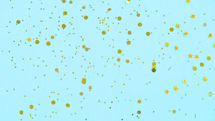 Gold glitter on blue background. Holiday abstract