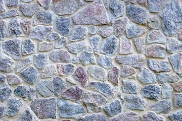Gray and blue stone wall texture, old floor background. Natural rock floor, pattern. Brick surface, frame. Grunge cement structure. An element of architectural design. Paving stone, cobblestone.